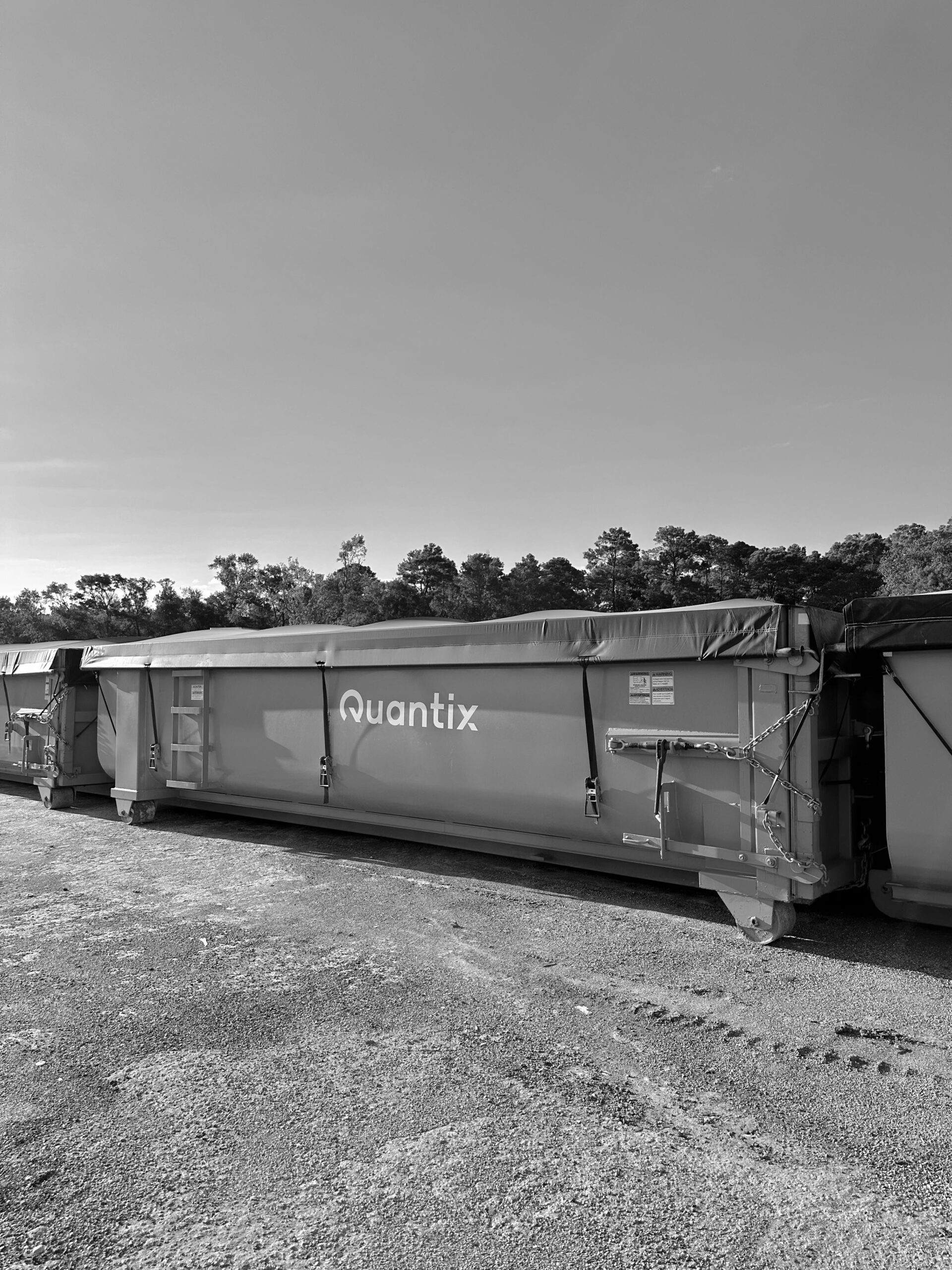 Quantix roll-off containers with tarp covers