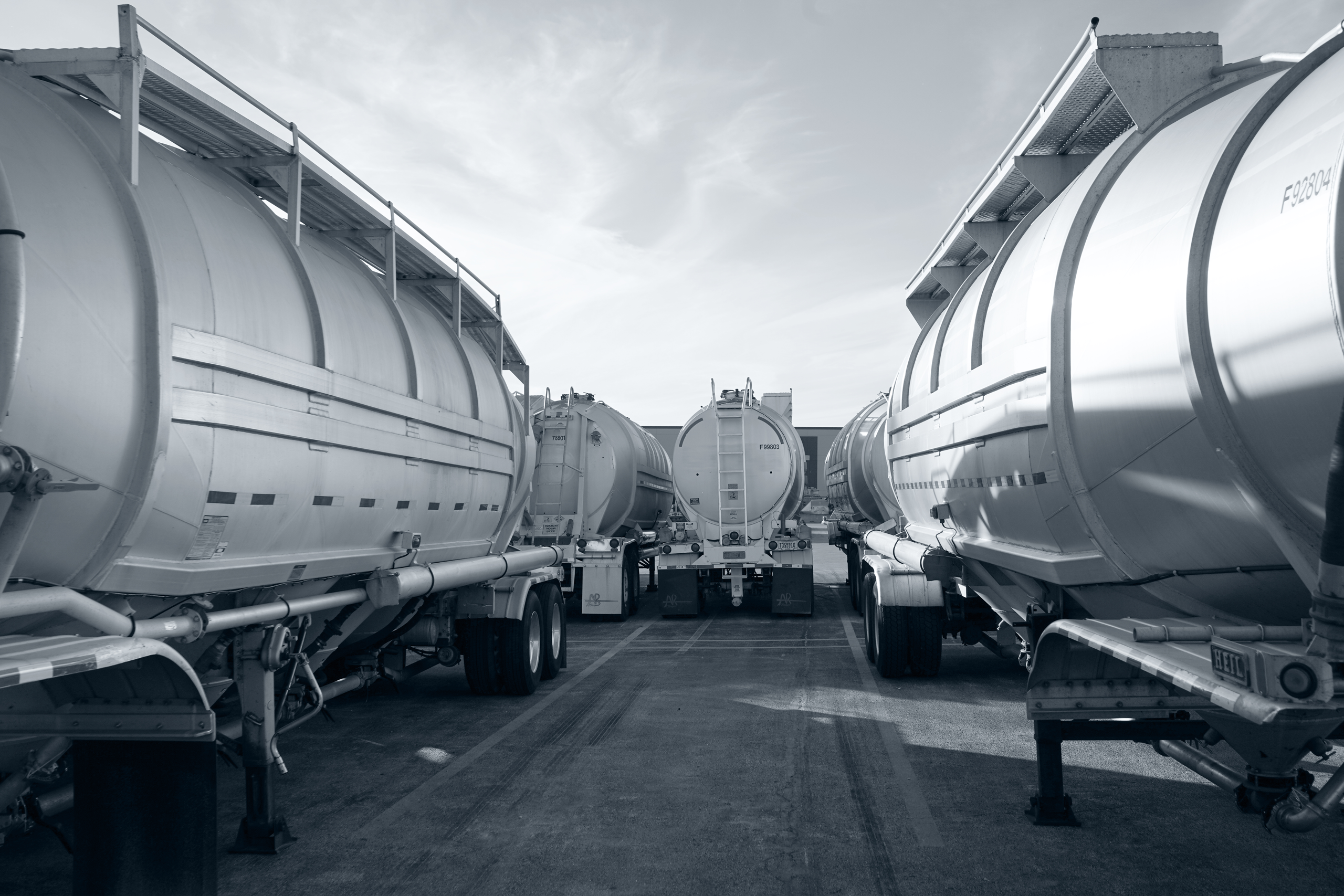 Line of transport trailers positioned at logistics yard during staging operations