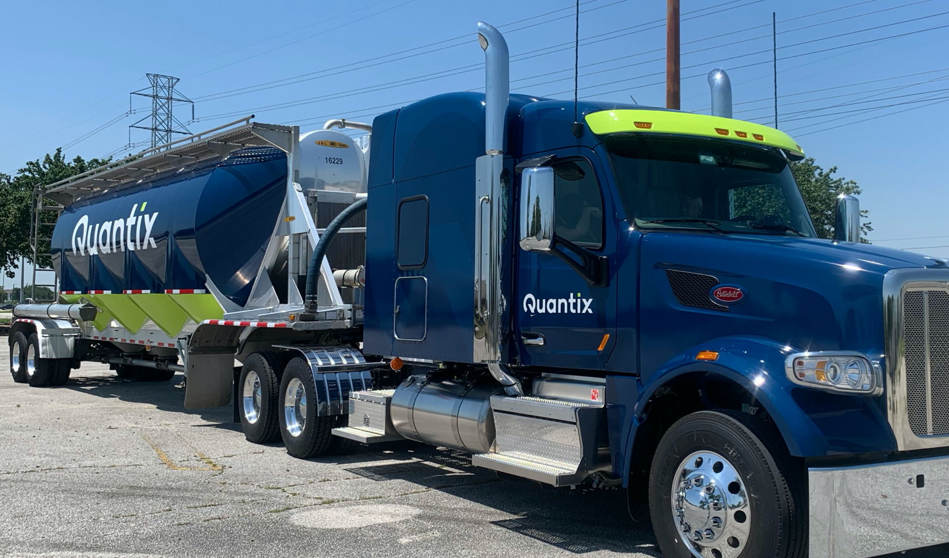 Quantix tractor-trailer staged for transport operations in chemical logistics network